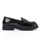 Tassel loafers in shinny black faux leather